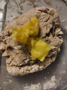 Dough with ghee in a bowl