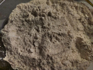 Mixture of atta flour and salt in a bowl