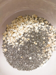 Rolled oats and chia seeds mixture in a cereal bowl