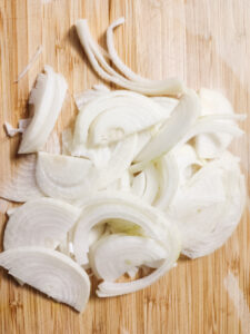 Sliced onions on a cutting board