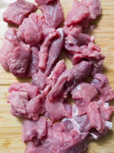 Thinly sliced beef fillet on a cutting board