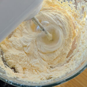 Incorporated eggs and vanilla extract in the bowl using a hand mixer