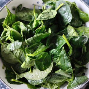 Washed spinach in a colander