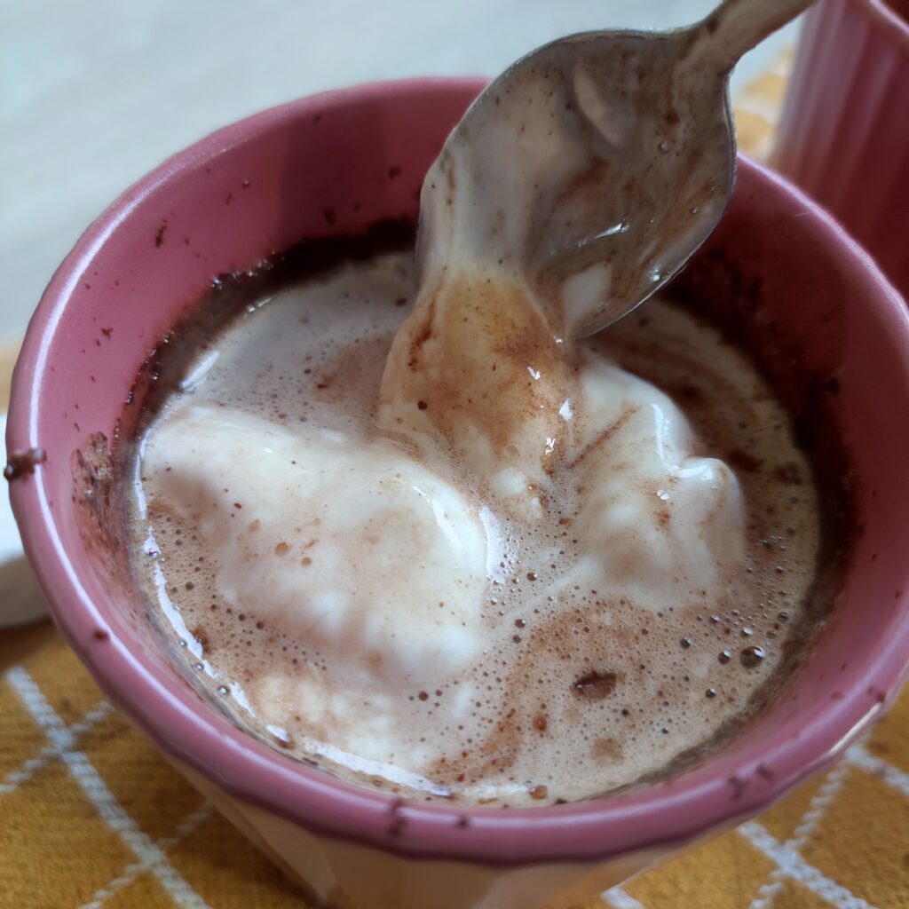 Creamy Hot Chocolate b - roll 2 : Hot Chocolate with melted marshmallow scooped by a spoon in a pink cup