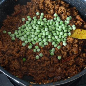 Adding frozen peas in the pan