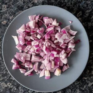 Chopped onions on a blue plate