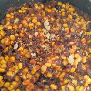 Adding chicken stock cube on a pan