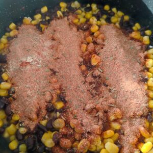 Adding taco seasoning on a pan