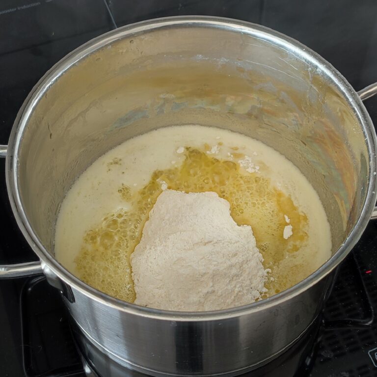 Adding all purpose flour to the melted butter in a pot