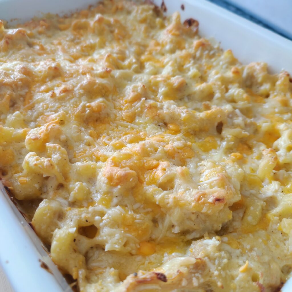 B roll 2 Classic Baked Mac & Cheese in a casserole dish with a serving spoon