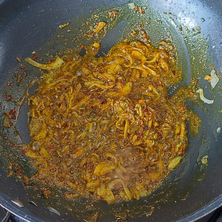 Sauteeing Spice mix with the lightly browned onions in a pan