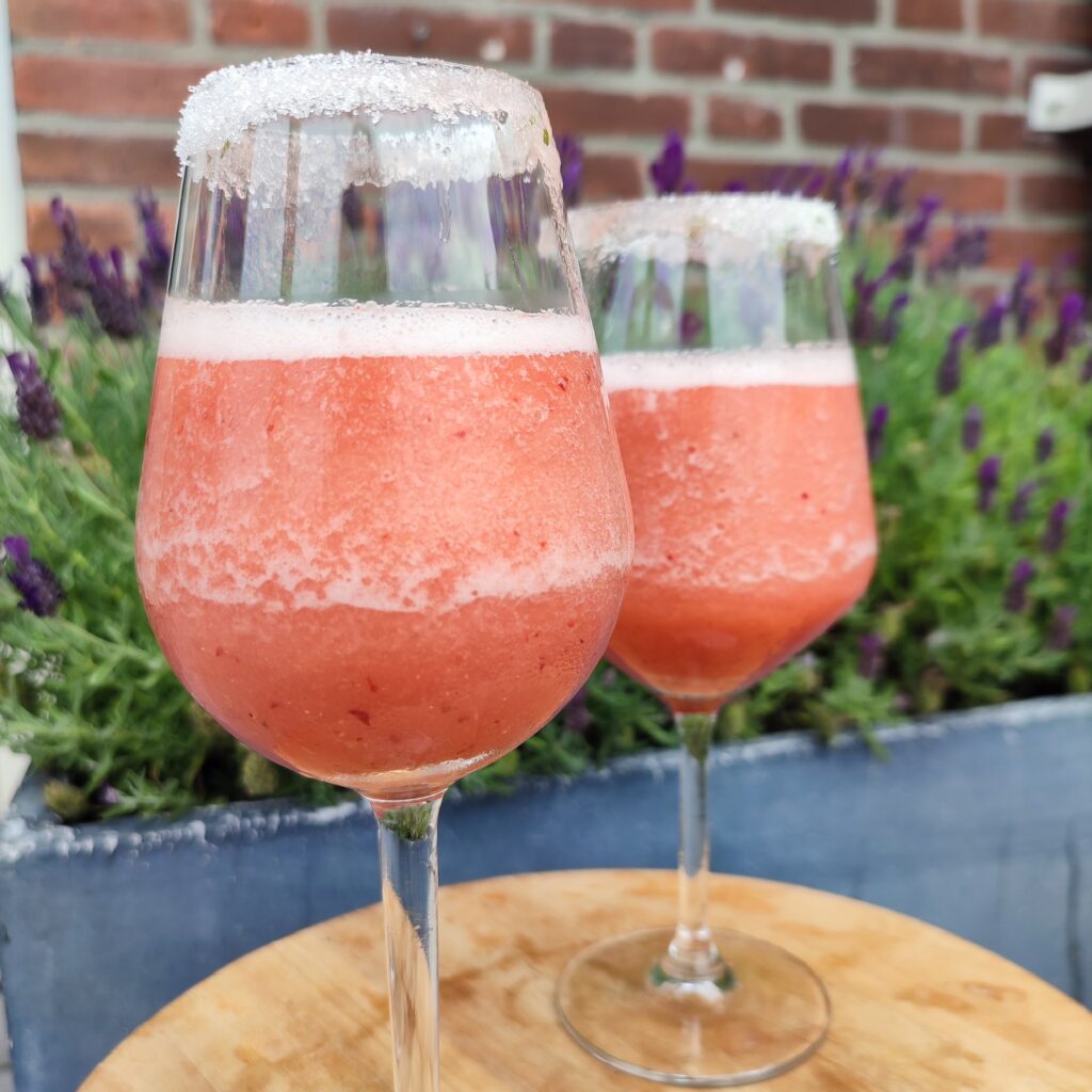 B roll 2 : Frosé Punch in wine glasses with the background of lavender flowers