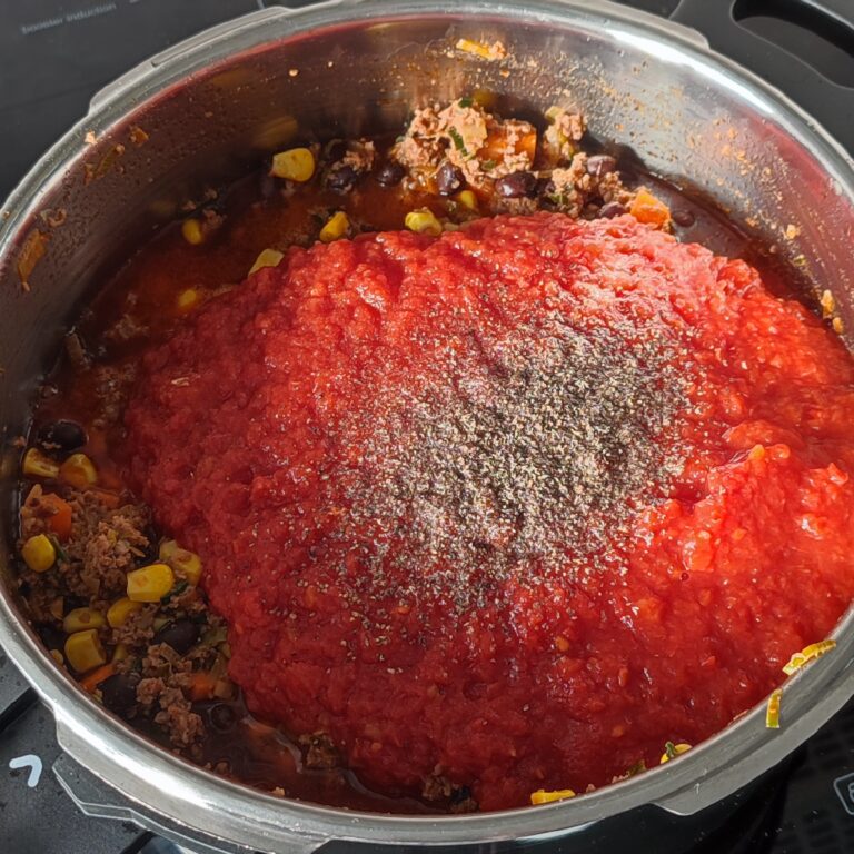 Add canned fine tomato pulps, salt and black pepper in the pot