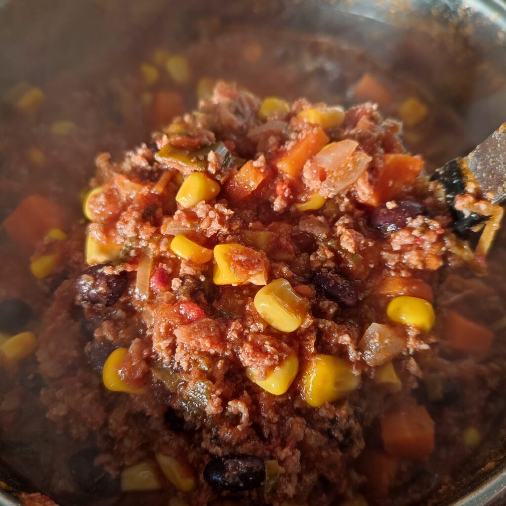 B shot 1: Chilli Con Carne scooped with a large ladle from the pot