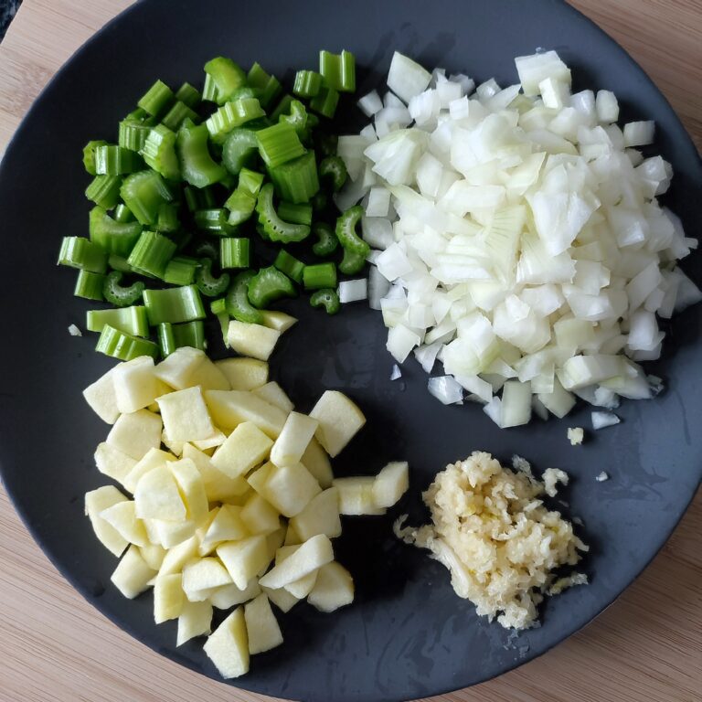 Prepped the vegetables and fruit on a large black plate