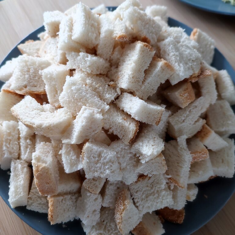 Prepped bread on a large black plate