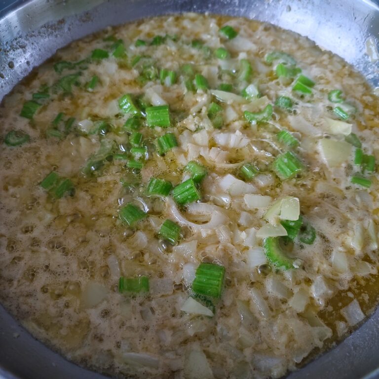 Cooking the base of vegetables and butter together in a large skillet