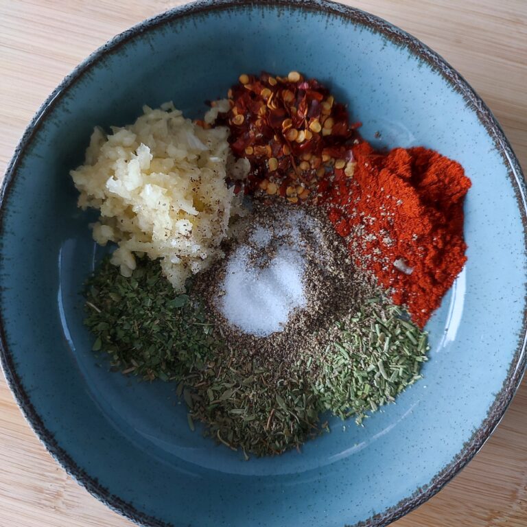 The Herb Butter Mix ingredients in a wide blue bowl