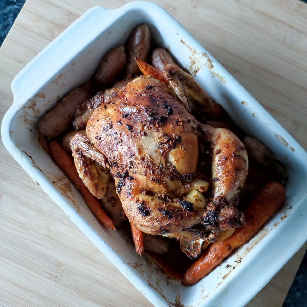 B shot 2: Christmas Roast Chicken with potatoes and carrots in a white rectangular casserole dish