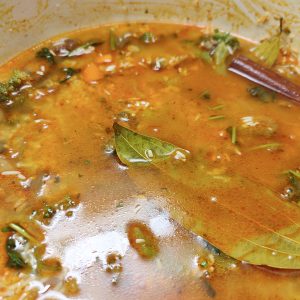 Adding water to cook the rice in a Dutch oven