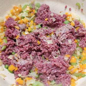 Adding minced meat with the rest of the ingredients in a Dutch oven