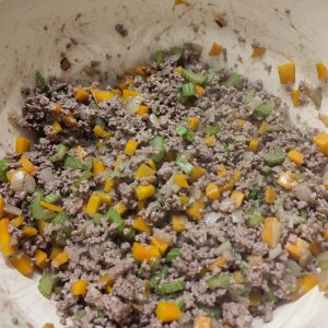 Browning minced meat evenly in a Dutch oven