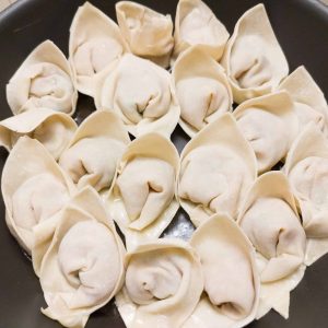 Cooking the potsticker in a shallow frying pan