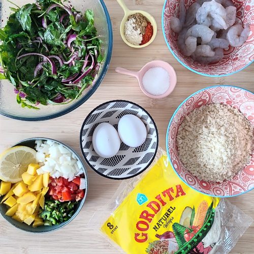 Ingredients for Crispy Shrimp Tacos with Spicy Mango Salsa on a working surface