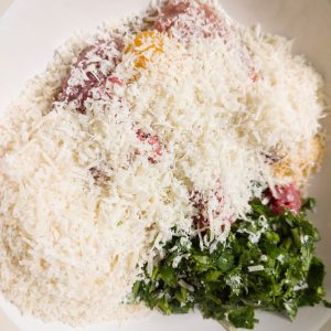 Mixing polpette ingredients in a bowl