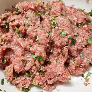 Mixed polpette ingredients (before forming into meatballs) in a bowl