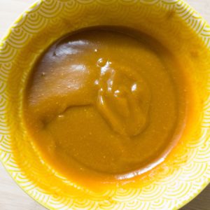 Lomo Saltado sauce mix in a yellow patterned bowl on a working surface