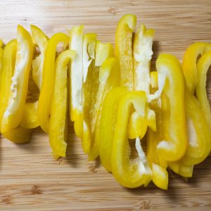 Sliced yellow bell pepper on a working surface