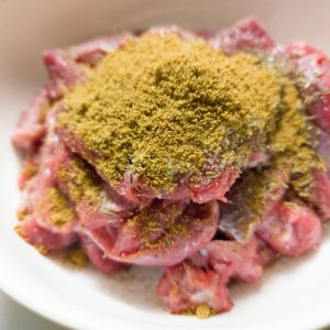 Sirloin steak marinade (before mixing) in a white bowl