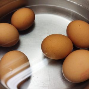 Boiling eggs in a deep steel pan