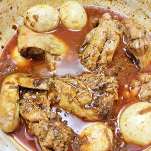 Adding boiled eggs to the rest in a casserole pan