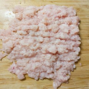 Minced chicken breast on a working surface