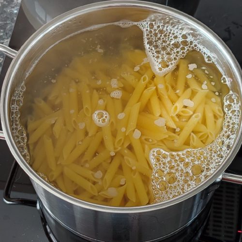 Pasta boiling in a pot on the stove