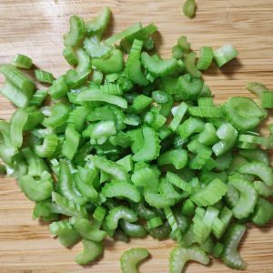 Sliced celery ribs on a cutting board