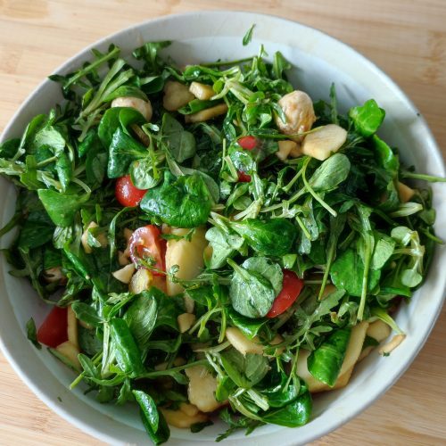 The Everything Salad ready to be served in a large bowl on a working surface