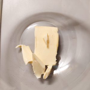 Unsalted butter (before melting) in a mixing bowl