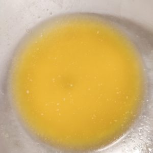 Unsalted butter (after melting) in a mixing bowl